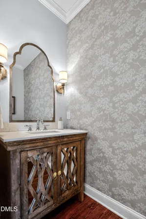 a dining room with wooden floor a glass table and chairs