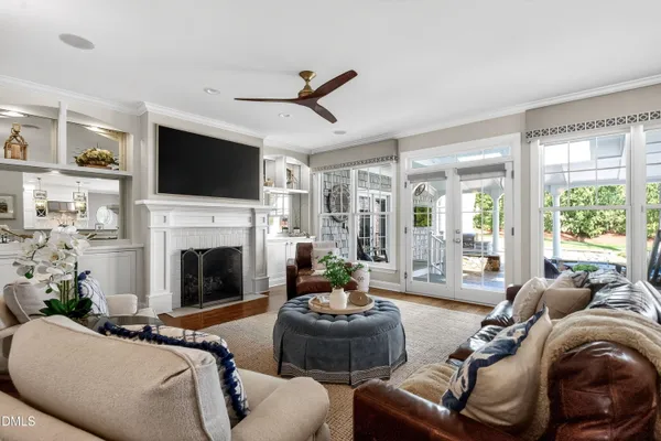 a kitchen with stainless steel appliances granite countertop a stove and a wooden floors