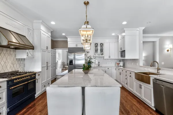 a bedroom with a bed couch and a fireplace