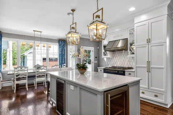a spacious bathroom with a double vanity sink a large mirror and a shower