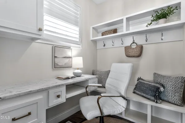 a bathroom with a sink a large mirror and a window