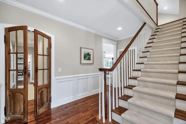 a view of kitchen with cabinets and window