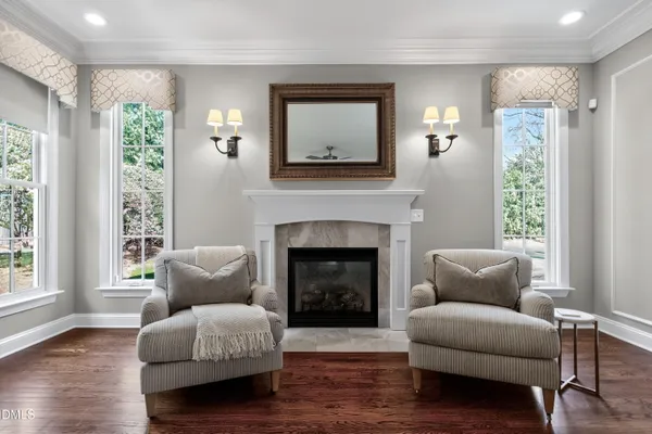 a bedroom with furniture and a ceiling fan