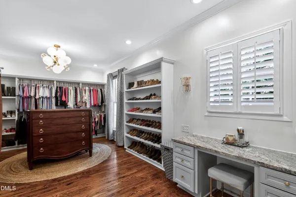a living room with fireplace furniture and a floor to ceiling window