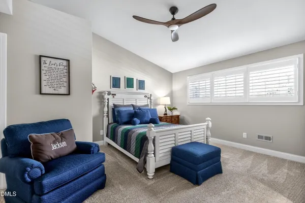 a view of a house with backyard porch and sitting area