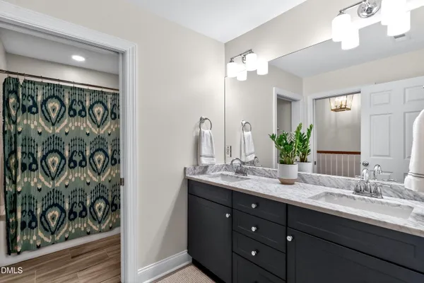 a front view of a house with a yard patio and green space