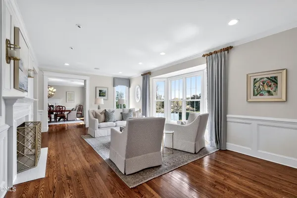 a view of a dining room with furniture window and wooden floor