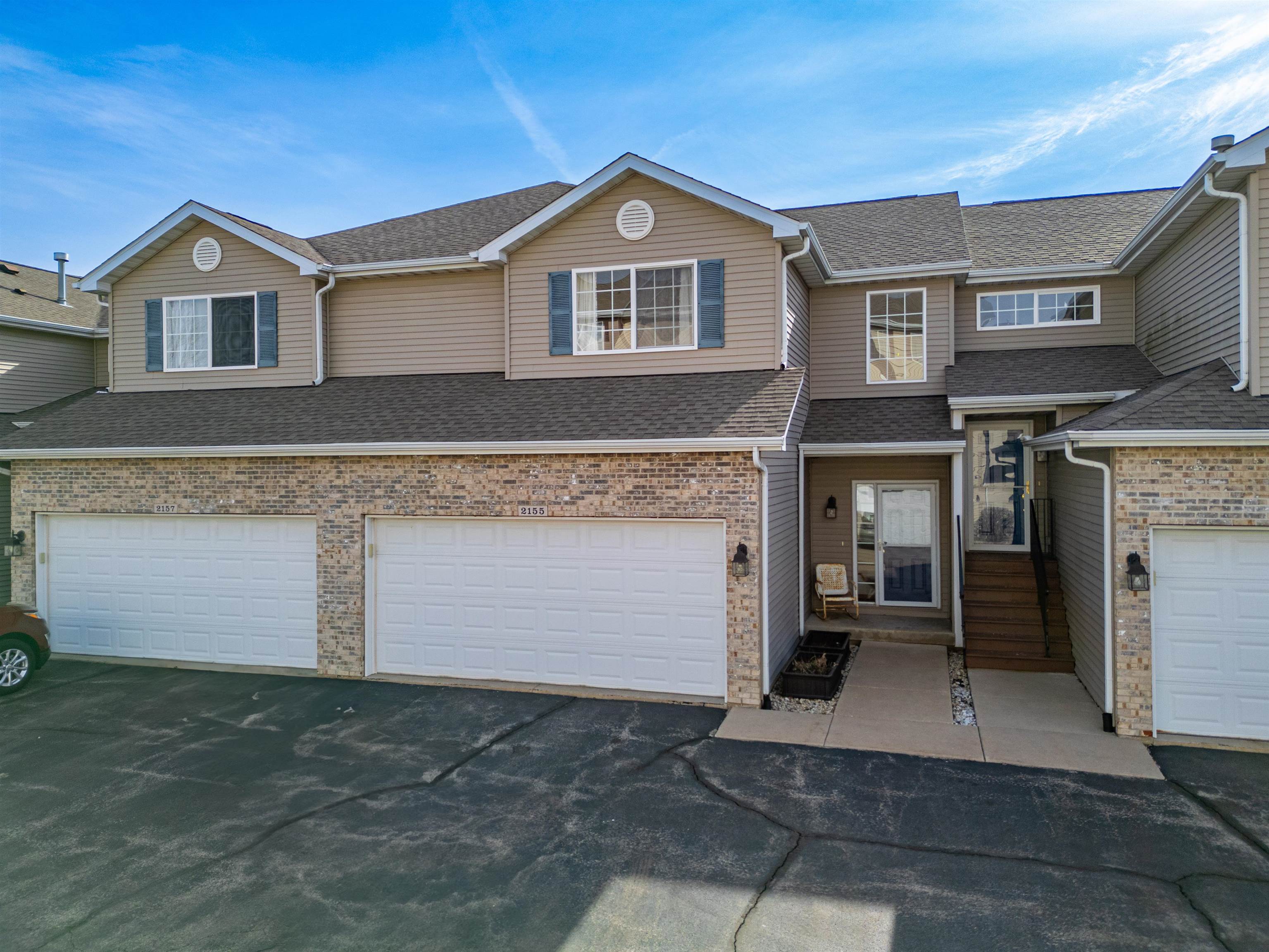 a front view of a house with a garage