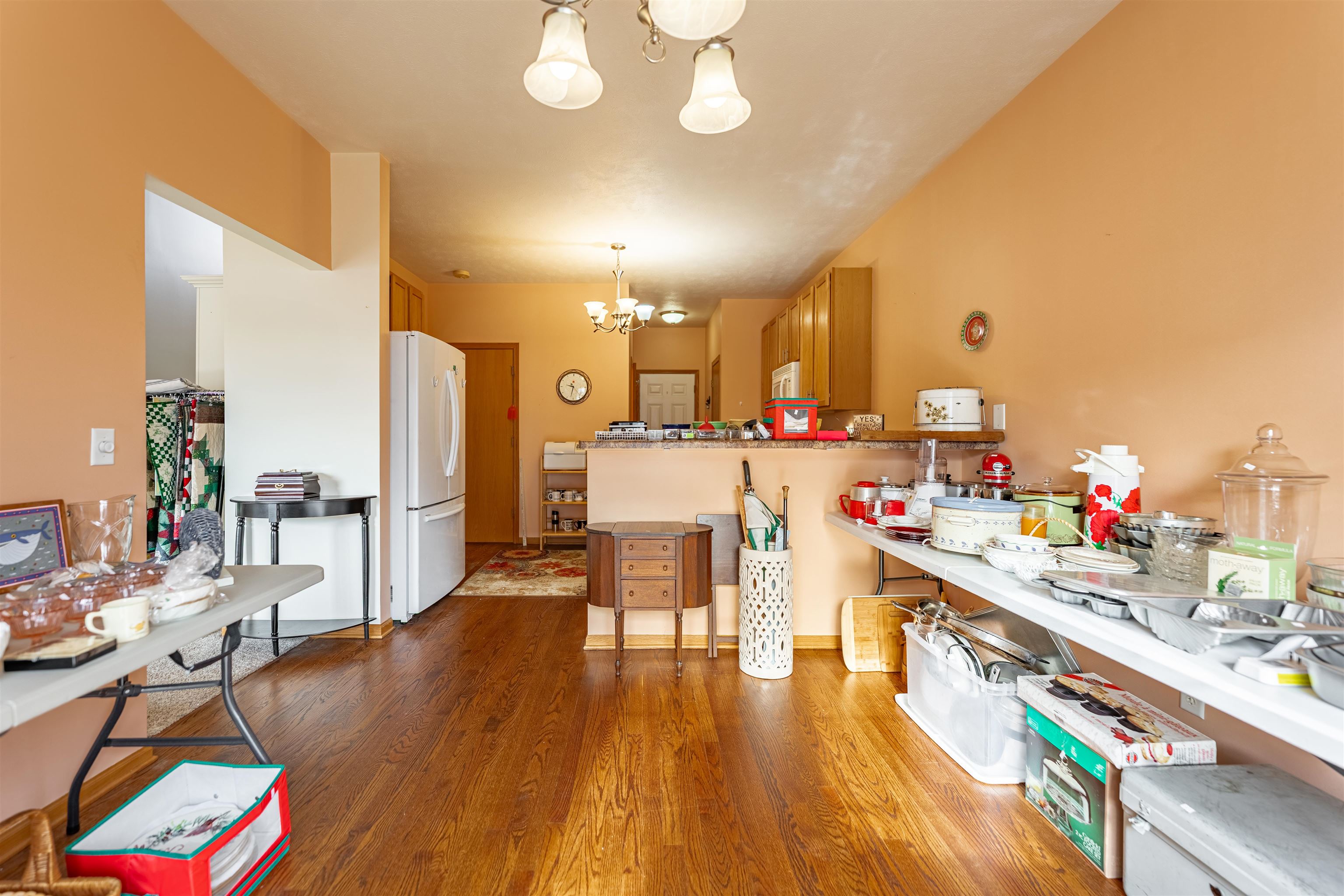 2155 Derby Lane Belvidere, IL 61008 - Photo 11 of 37 a kitchen with stainless steel appliances kitchen island granite countertop a table chairs and a wooden floor