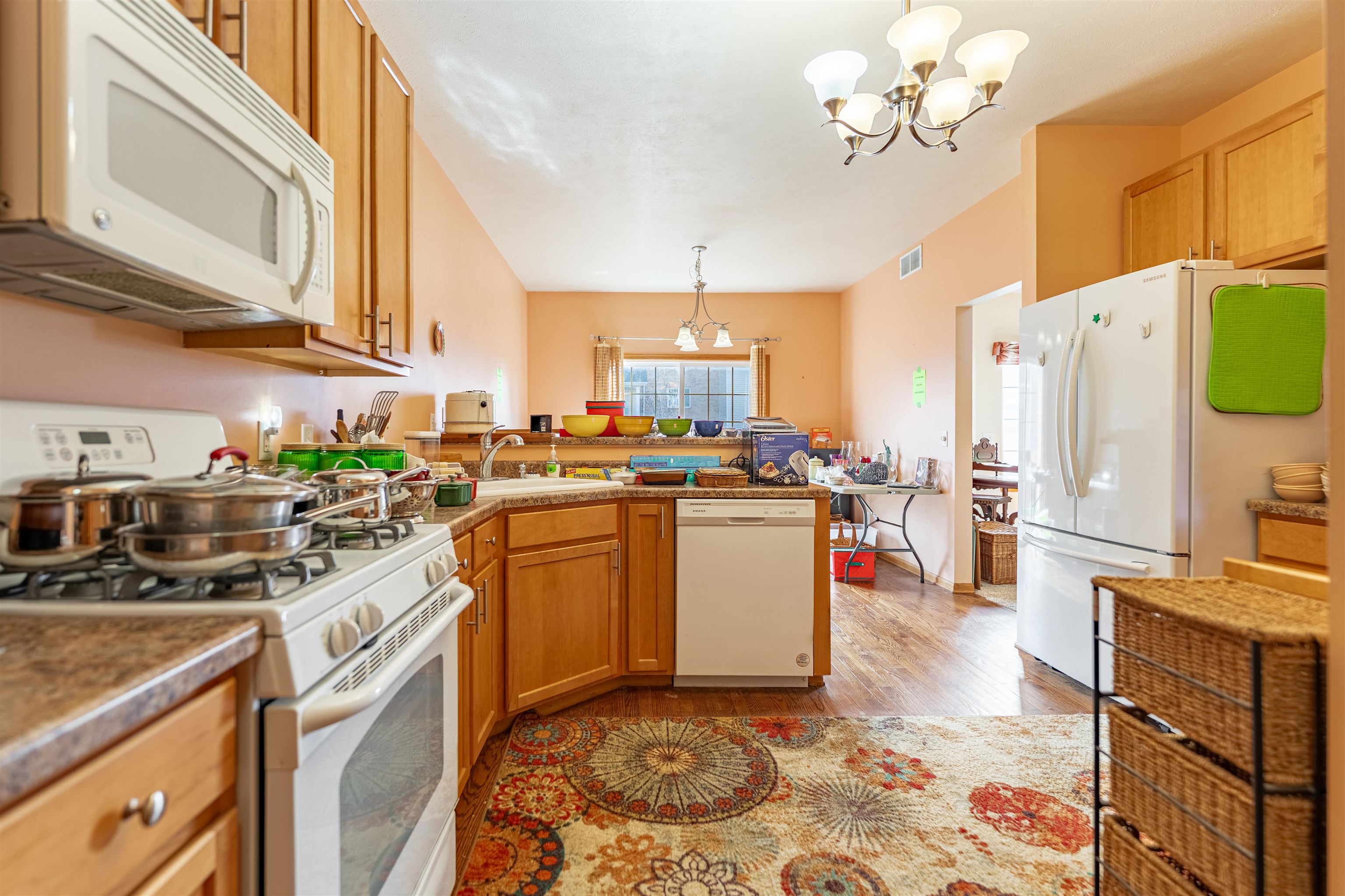 2155 Derby Lane Belvidere, IL 61008 - Photo 13 of 37 a kitchen with stainless steel appliances granite countertop a sink a stove and refrigerator