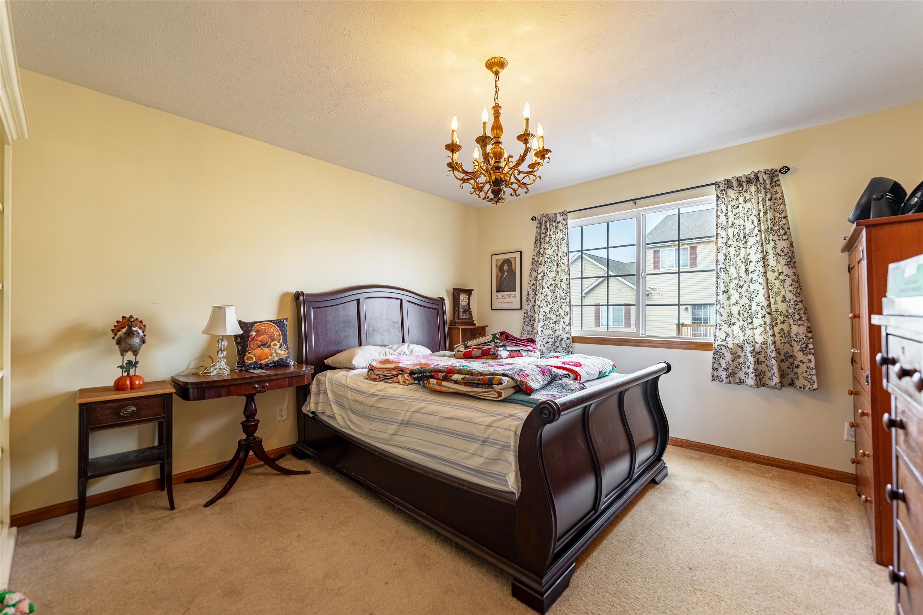 2155 Derby Lane Belvidere, IL 61008 - Photo 16 of 37 a bedroom with a bed and a chandelier