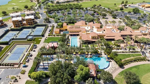 an aerial view of residential building and lake