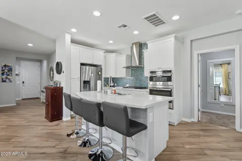 a view of a building with snow on the road