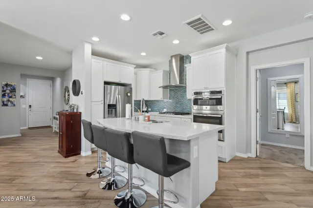 a view of a building with snow on the road