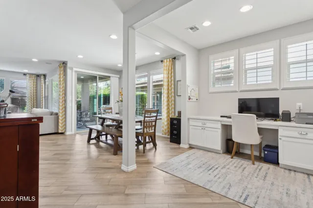 a view of living room with furniture and wooden floor