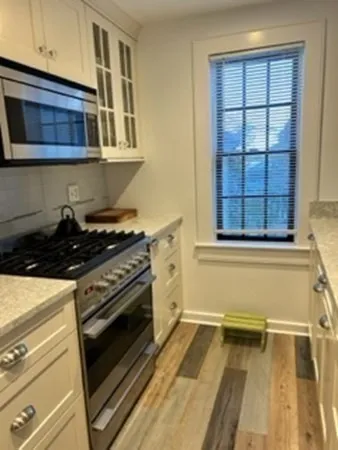 a kitchen with a stove and a microwave
