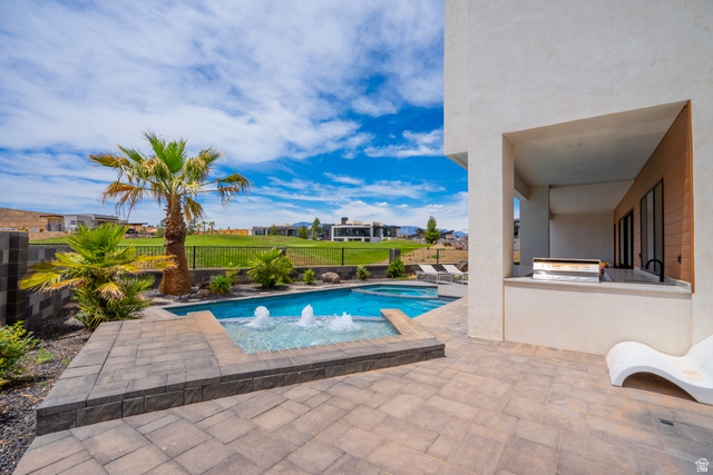 3606 South Cypress Road Hurricane, UT 84737 - Photo 65 of 69 Combined pool / hot tub with a patio, area for grilling, a fenced backyard, and a residential view