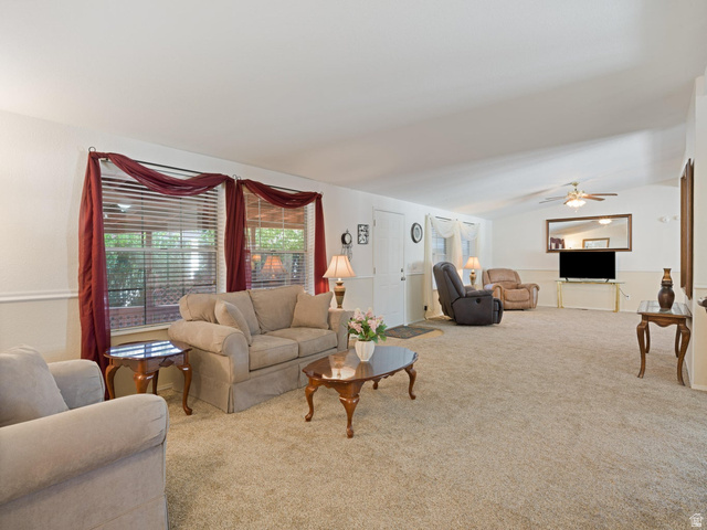 3941 West 40 North Hurricane, UT 84737 - Photo 9 of 55 Spacious living area featuring neutral carpeting, a vaulted ceiling, and two large windows with blinds