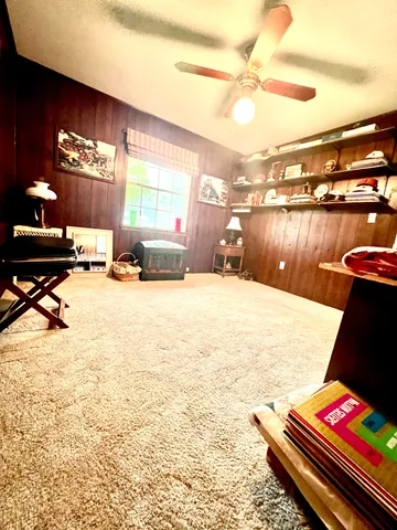 a bedroom with a bed and a mirror