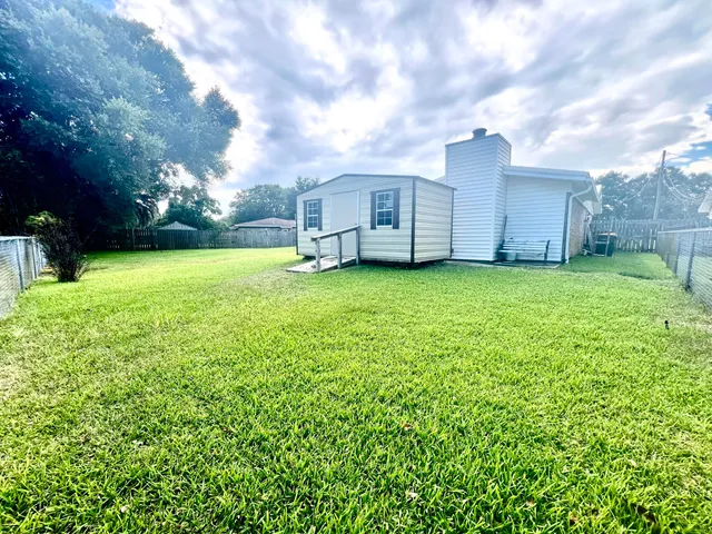 a view of a backyard with garden