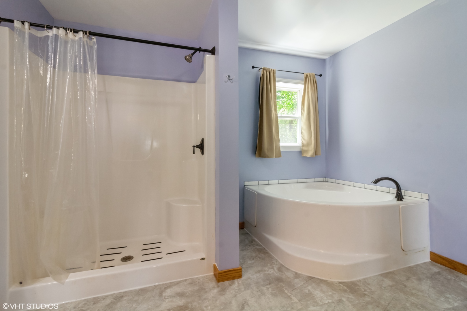 32597 Genoa Road Genoa, IL 60135 - Photo 13 of 31 a bathroom with a sink a mirror and a bathtub