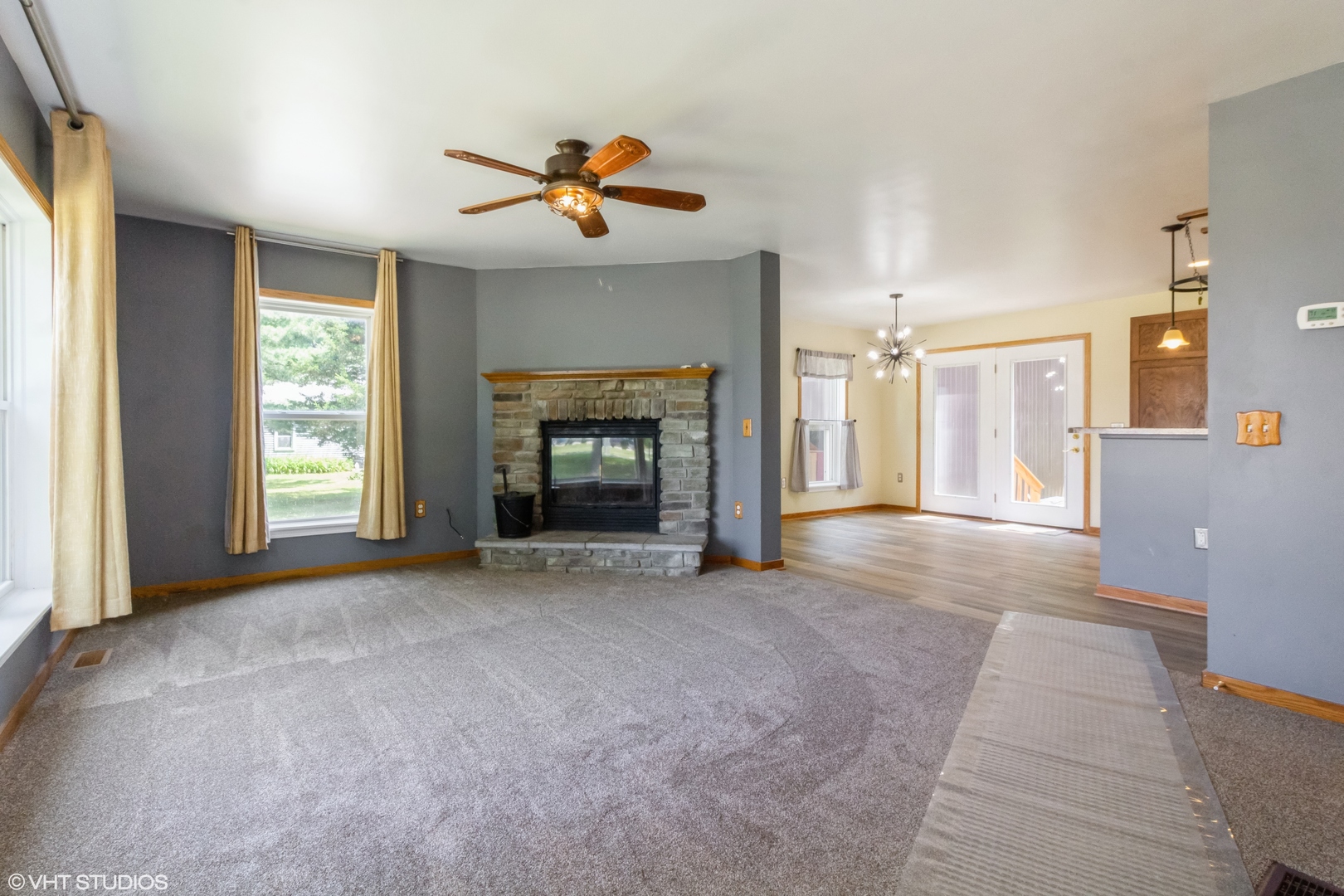 32597 Genoa Road Genoa, IL 60135 - Photo 3 of 31 a view of an empty room with window and fire place