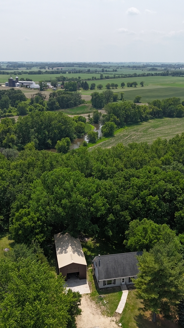 32597 Genoa Road Genoa, IL 60135 - Photo 31 of 31 an aerial view of a house with a yard