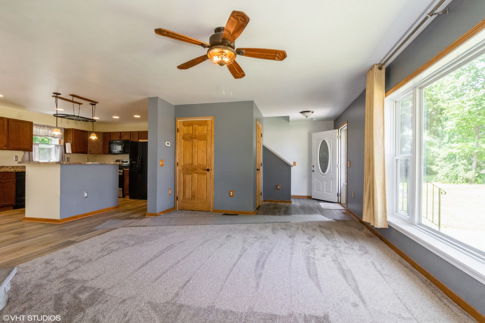 32597 Genoa Road Genoa, IL 60135 - Photo 4 of 31 a view of a livingroom with a ceiling fan and window