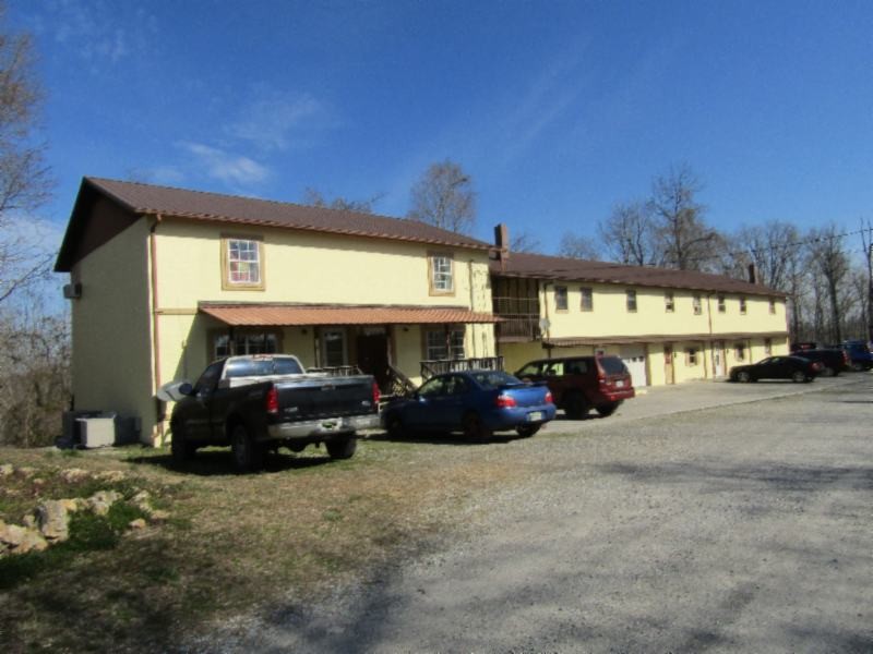 182 Ridge View Lane Baxter, TN 38544 - Photo 22 of 26 a car parked in front of a building