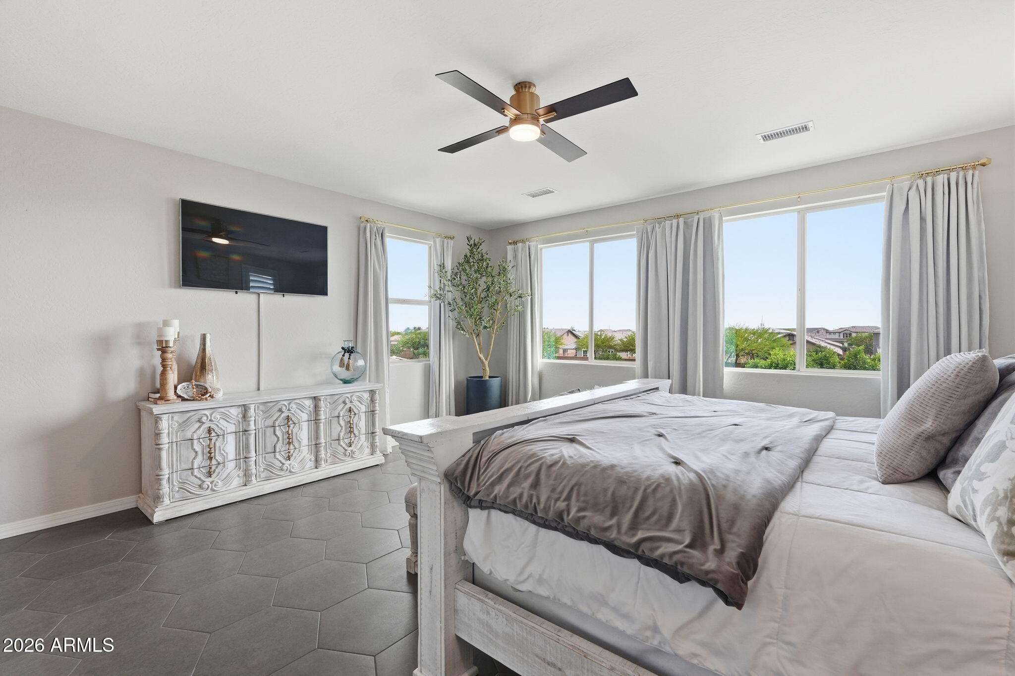 22607 East Russet Road Queen Creek, AZ 85142 - Photo 26 of 64 a bed sitting in a bedroom next to a window