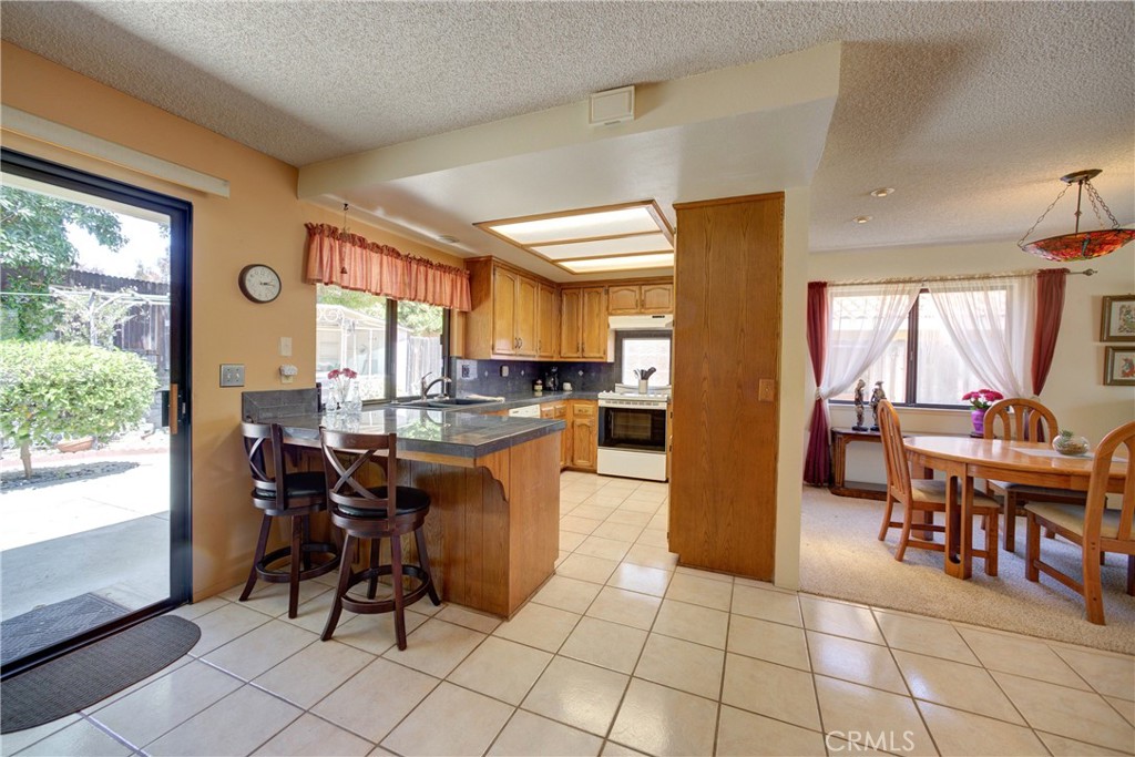 4185 Vanguard Drive Lompoc, CA 93436 - Photo 14 of 44 a view of a dining room with furniture and a large window
