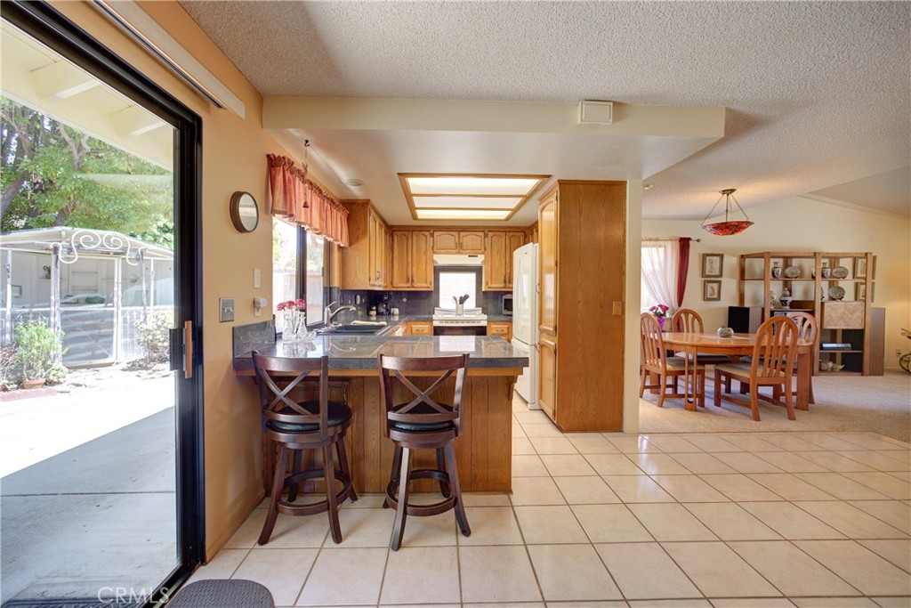 4185 Vanguard Drive Lompoc, CA 93436 - Photo 15 of 44 a view of a dining area with furniture window and outside view