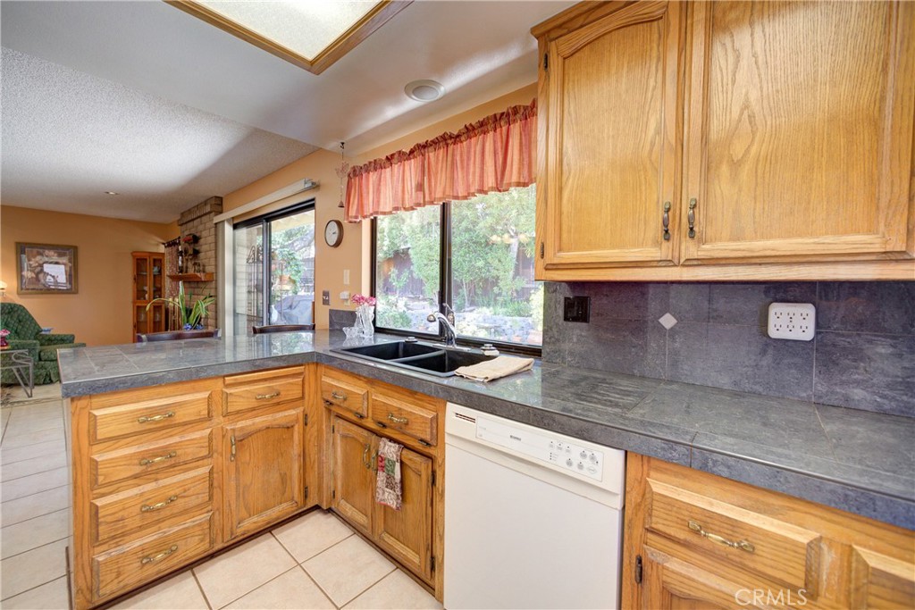 4185 Vanguard Drive Lompoc, CA 93436 - Photo 17 of 44 a kitchen with granite countertop a sink and cabinets