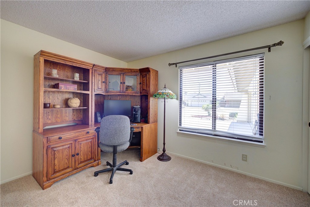 4185 Vanguard Drive Lompoc, CA 93436 - Photo 19 of 44 a view of a livingroom with workspace and a window