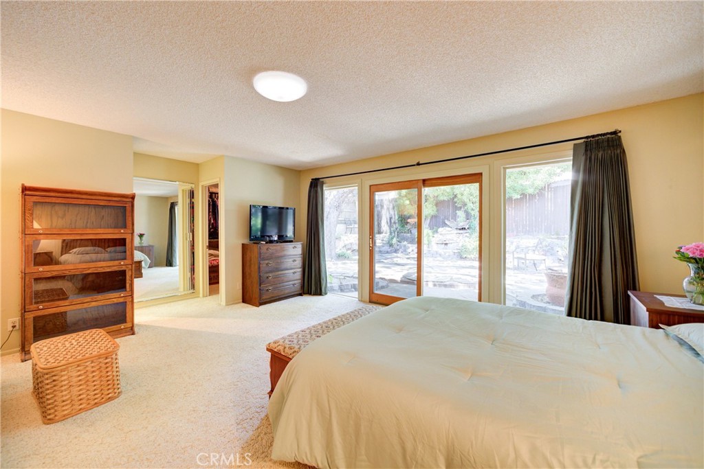 4185 Vanguard Drive Lompoc, CA 93436 - Photo 23 of 44 a spacious bedroom with a large bed and a large window