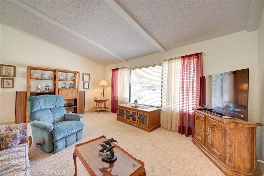 4185 Vanguard Drive Lompoc, CA 93436 - Photo 7 of 44 a living room with furniture and a flat screen tv