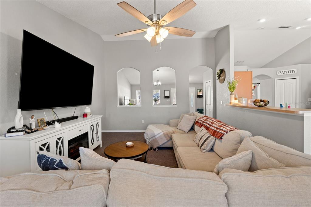 15335 Fleetwood Road Weeki Wachee, FL 34614 - Photo 19 of 40 a living room with furniture and a flat screen tv