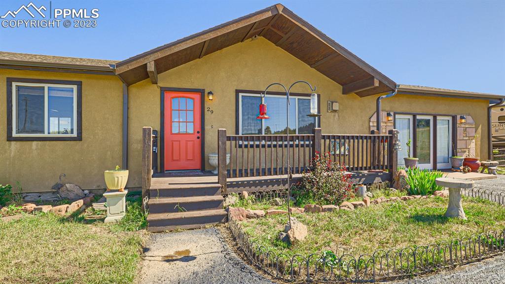 29 Ridge Point Circle Divide, CO 80814 - Photo 11 of 50 a front view of house along with deck and outdoor seating
