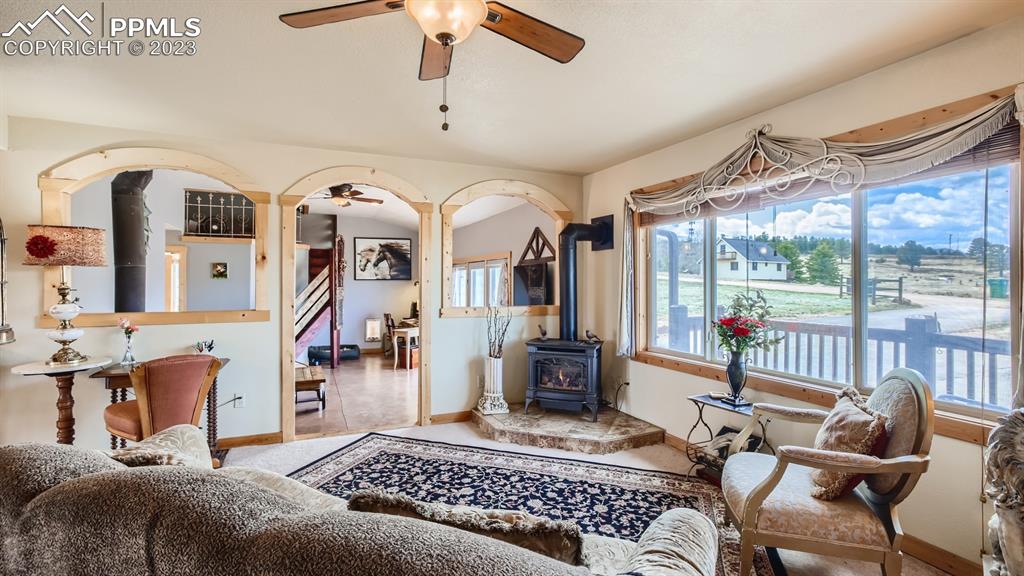 29 Ridge Point Circle Divide, CO 80814 - Photo 15 of 50 a living room with furniture a flat screen tv and a large window