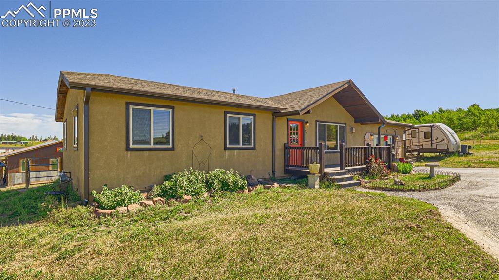 29 Ridge Point Circle Divide, CO 80814 - Photo 2 of 50 a front view of a house with garden