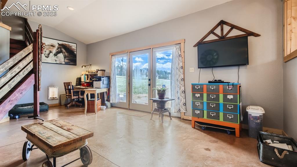 29 Ridge Point Circle Divide, CO 80814 - Photo 23 of 50 a living room with furniture a flat screen tv and a floor to ceiling window