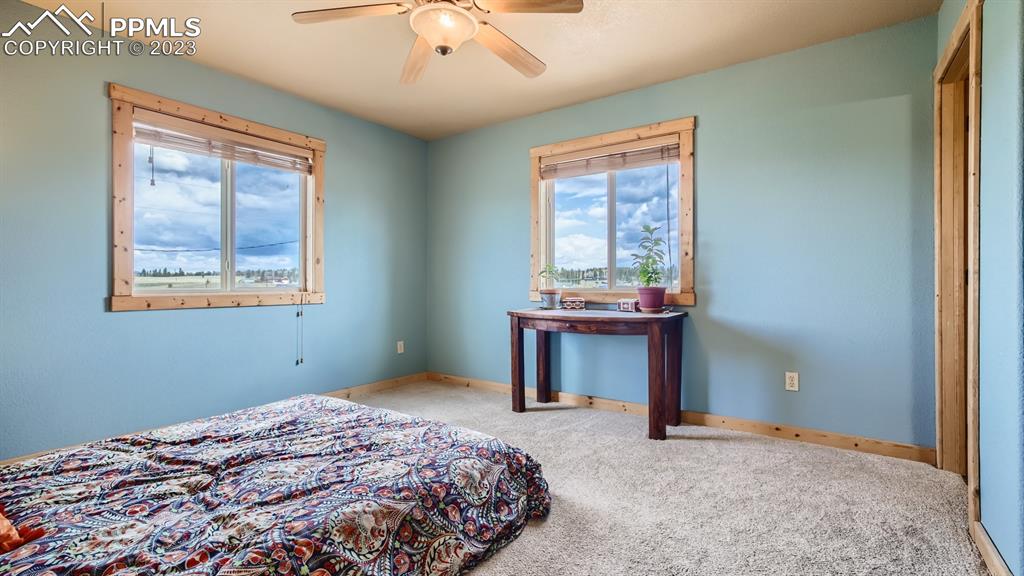 29 Ridge Point Circle Divide, CO 80814 - Photo 26 of 50 a bedroom with a bed and a window