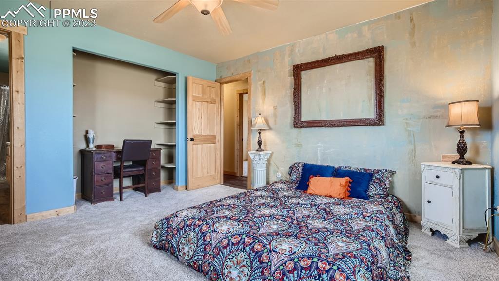 29 Ridge Point Circle Divide, CO 80814 - Photo 27 of 50 a bedroom with a bed and wooden floor