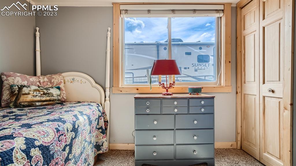 29 Ridge Point Circle Divide, CO 80814 - Photo 35 of 50 a bedroom with a bed and a window