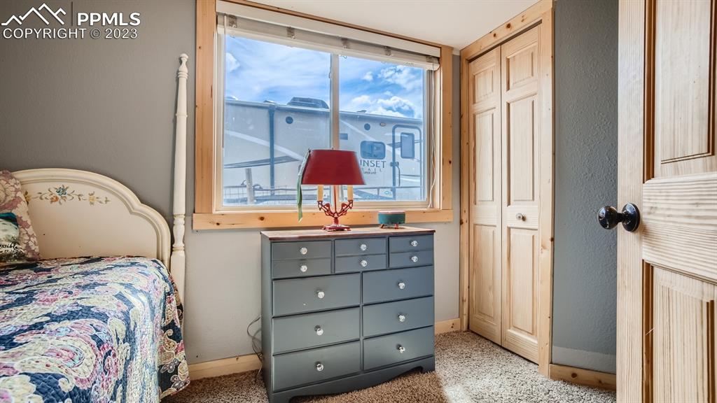 29 Ridge Point Circle Divide, CO 80814 - Photo 36 of 50 a bedroom with a bed and a window