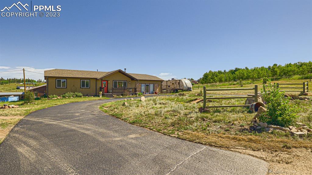 29 Ridge Point Circle Divide, CO 80814 - Photo 4 of 50 a front view of a house with a yard