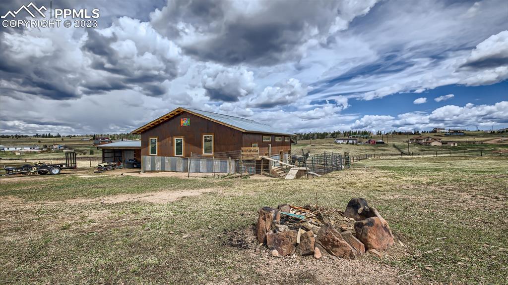 29 Ridge Point Circle Divide, CO 80814 - Photo 45 of 50 a view of a house with a yard and a large tree