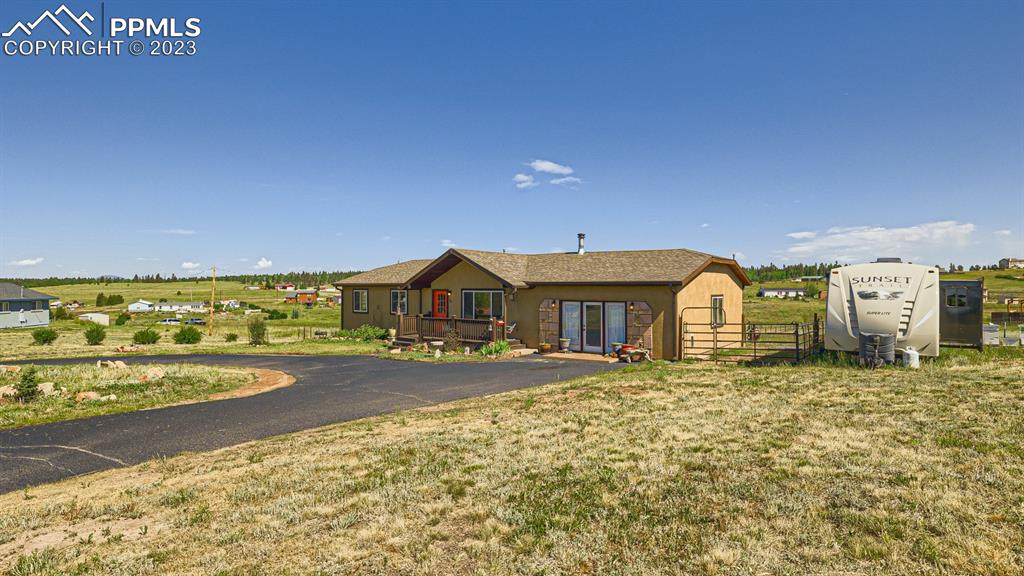 29 Ridge Point Circle Divide, CO 80814 - Photo 7 of 50 a front view of a house with a yard