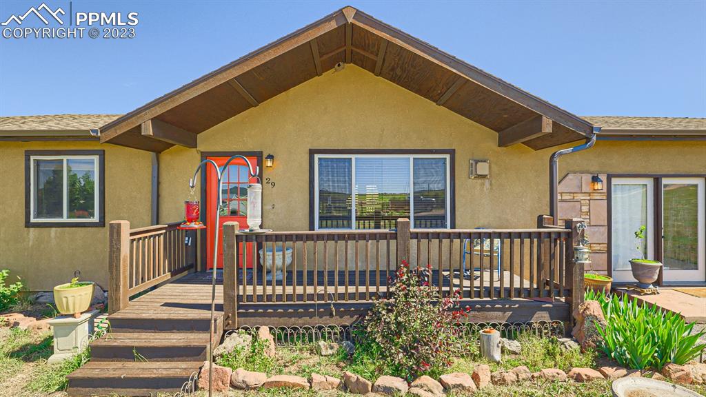 29 Ridge Point Circle Divide, CO 80814 - Photo 8 of 50 a view of a house with wooden deck and furniture
