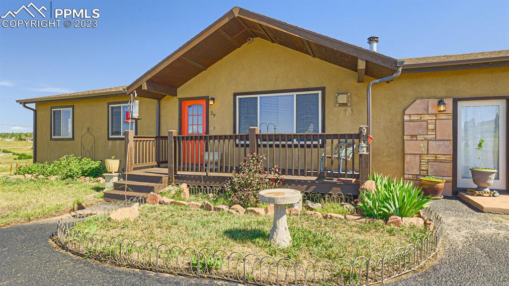 29 Ridge Point Circle Divide, CO 80814 - Photo 10 of 50 a front view of a house with garden